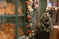 Old bakery window on christmas eve. Freshly baked bread and rolls are sold in bakery window. Showcase with traditional french past Royalty Free Stock Photo