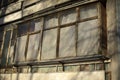 Old balcony in house. Wooden window frames. Building is in detail