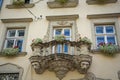 Old balcony with a lion head sculpture in Lviv