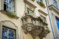 Old balcony with a lion head sculpture in Lviv