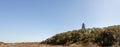 Old Baldy Lighthouse over wetlands Royalty Free Stock Photo