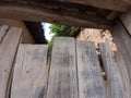 Old Balkan house wooden door and a clay wall. Vintage village clay bricks wall