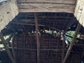 Old Balkan house wooden roof and a clay wall. Vintage village clay bricks wall Royalty Free Stock Photo