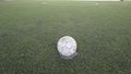 Old ball on new ground Royalty Free Stock Photo