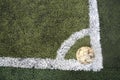 Old ball on new soccer ground Royalty Free Stock Photo