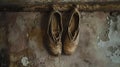 Old ballet shoes hanging near a weathered wall, AI-generated.