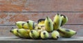 Old bananas on wooden shelf Royalty Free Stock Photo
