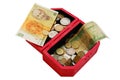 Old banknotes and coins in wooden casket Royalty Free Stock Photo