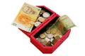 Old banknotes and coins in wooden casket