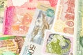 Old banknotes from various exotic countries. Colorful money back. Close-up macro