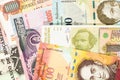 Old banknotes from various exotic countries. Colorful money background. Close-up macro