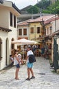 Old Bar, Montenegro, June, 200, 2015. Tourists with a small child at the hands walking along the tourist street in the Old town