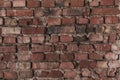 Old bare brick wall with red bricks close up Royalty Free Stock Photo