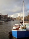 Old barges converted to houseboats on the canals of Amsterdam in