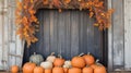 An old barn adorned with autumn wreaths and pumpkins