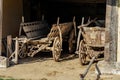 Old barn with agricultural weathered wooden chariot