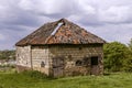 Old barn built from mixed building materials that were available locally such as marl.