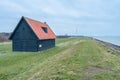 Old barn at the coast of Wieringerwerf, The Netherlands Royalty Free Stock Photo