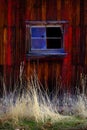 Old Barn in Field in Late Fall Autumn Brown Grass Weathered Red Royalty Free Stock Photo