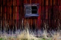 Old Barn in Field in Late Fall Autumn Brown Grass Weathered Red Wood Royalty Free Stock Photo