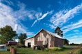 Old barn in front of a blue sky Royalty Free Stock Photo