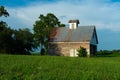 Old barn and grass field Royalty Free Stock Photo