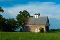 Old barn and grass field Royalty Free Stock Photo