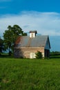 Old barn and grass field Royalty Free Stock Photo