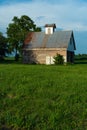 Old barn and grass field Royalty Free Stock Photo