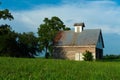 Old barn and grass field Royalty Free Stock Photo