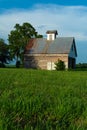 Old barn and grass field Royalty Free Stock Photo