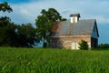 Old barn and grass field Royalty Free Stock Photo