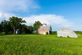 Old barn in grass field Royalty Free Stock Photo