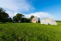 Old barn in grass field Royalty Free Stock Photo