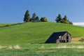 Old barn by hill. Royalty Free Stock Photo