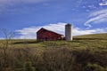 Old Barn on a HIll with Vibrant Blue Sky Royalty Free Stock Photo