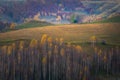 Old barn house on top of a hill with some cows around the barn on an autumn day Royalty Free Stock Photo