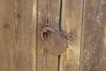 an old barn lock on a wooden door. Rusty lock Royalty Free Stock Photo