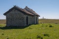 An old stone house stands on a green meadow. Oland, Sweden