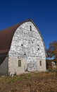 Old barn with peeling paint and a new metal roof Royalty Free Stock Photo