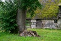 An old barn with a roof covered with moss Royalty Free Stock Photo