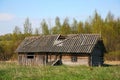 Old barn scene in western Russia. rustic old farm building. old rustic barn. Pskov oblast, Northwest part of Russia, Europe. Royalty Free Stock Photo