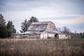 Old barn standing on farm landscape Royalty Free Stock Photo