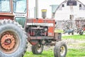 Old Barn with Vintage Hiniker Turbo Farm Tractor Royalty Free Stock Photo