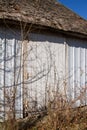 Old barn wall with newer white siding and original wood shingles Royalty Free Stock Photo