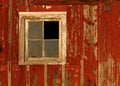 Old barn window on red wall