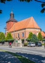Old baroque church in countryside with cars parked Royalty Free Stock Photo