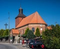 Old baroque church in countryside with cars parked Royalty Free Stock Photo