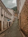 Old baroque houses in narrow stone made street at Ouro Preto city, state of Minas Gerais, Brazil