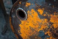 Old rusty oil barrel with orange paint Royalty Free Stock Photo